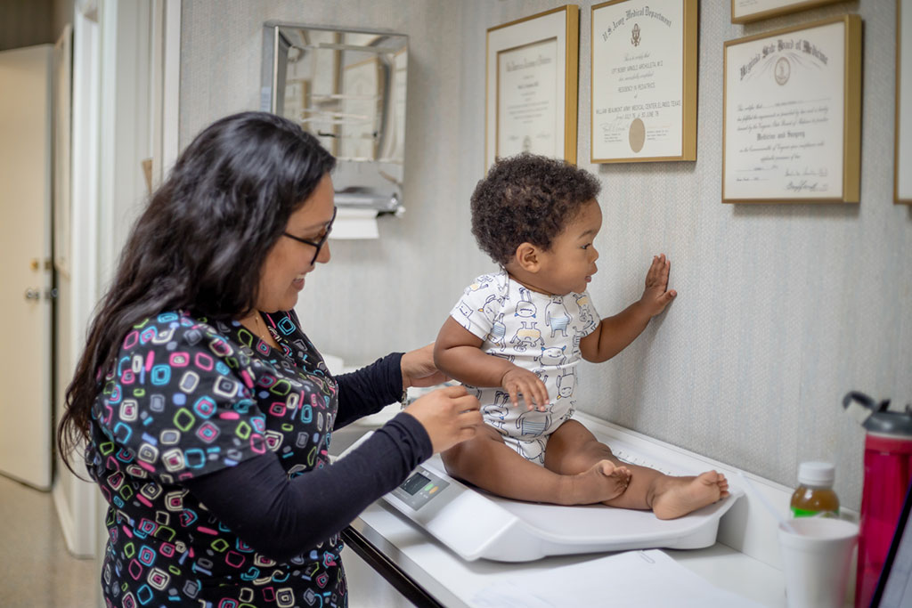 Pediatric Services for Babies - Dr. Archuleta at Pediatric Associates greets a mother and baby